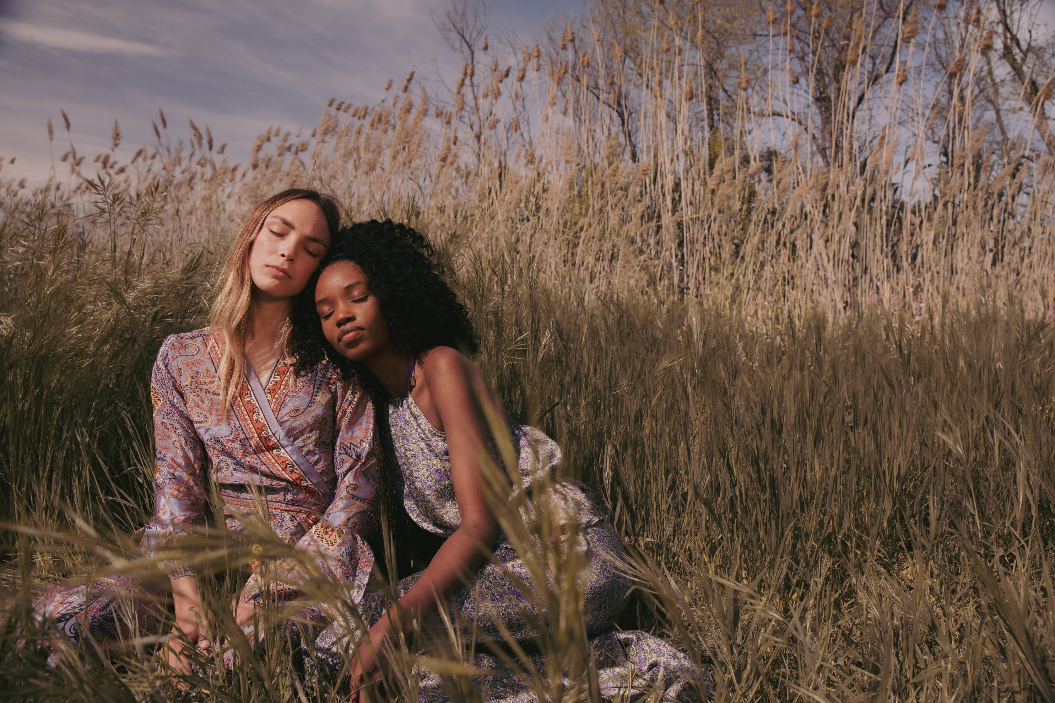 Two Fashionable Women Resting in the Field